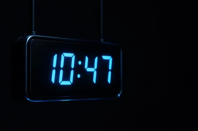 Glowing Blue Digital Clock on Black