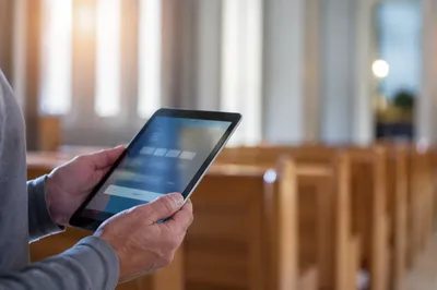 Digital Giving Tablet in Church Interior