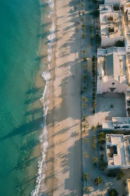 Aerial Seaside Church Along Quiet Shoreline