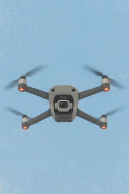 Modern Camera Drone in Clear Blue Sky