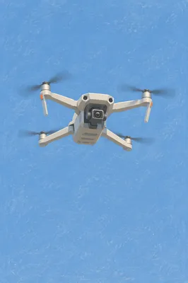 Minimal Drone Hovering in Blue Sky