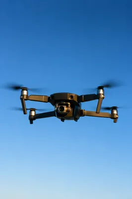 Photorealistic Drone Hovering in Clear Blue Sky