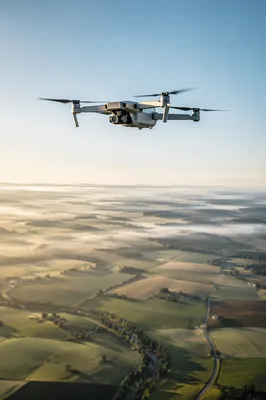 Camera Drone Hovering Over Morning Farmland