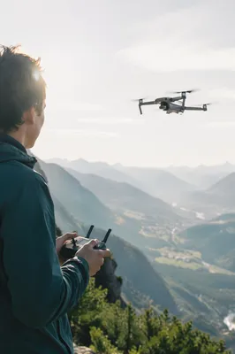 Camera Drone Hovering Above Mountain Valley