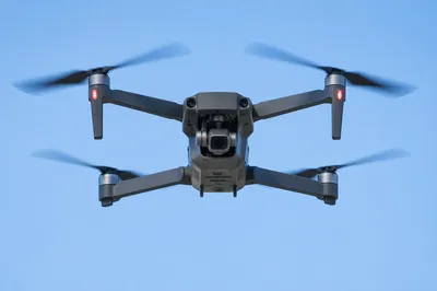 Photorealistic Camera Drone in Clear Blue Sky