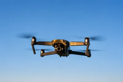 Photorealistic Drone Hovering in Clear Blue Sky