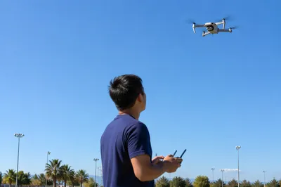 Drone Pilot Under Clear Blue Sky