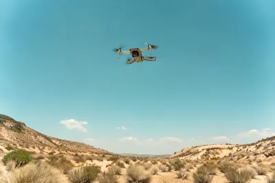 Aerial Drone Hovering Over Desert Landscape