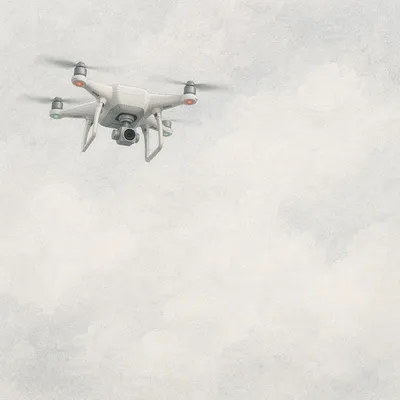 White Quadcopter Drone in Overcast Sky
