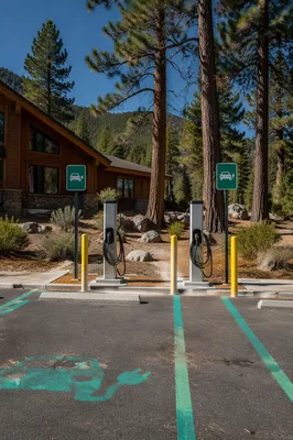 Green EV Charging Station by Mountain Lodge