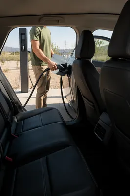 Electric Car Charging in Sunlit Parking Area