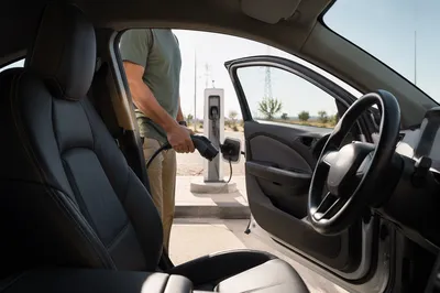 Electric Car Charging in Sunny Parking Lot
