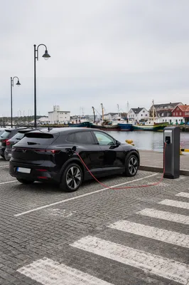 Electric SUV Charging at Harbor Parking Lot