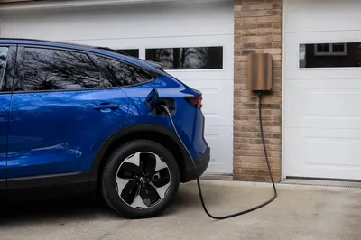 Blue Electric SUV Charging at Home
