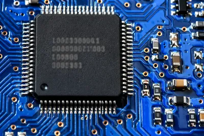 Macro Microchip on Blue Circuit Board
