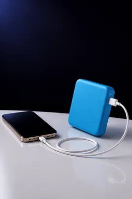 Cyan Power Bank Charging Phone Still Life