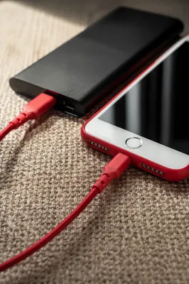 Red Cable Power Bank Charging Flat Lay