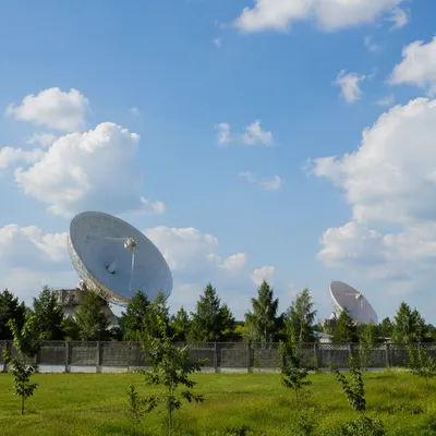 Satellite Dishes Under Bright Blue Sky