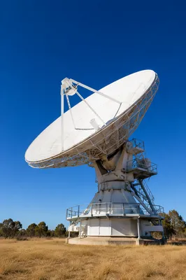 Satellite Communication Dish Under Clear Blue Sky