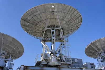 Satellite Dish Array Under Clear Blue Sky