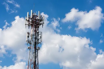 Telecommunication Tower Under Bright Blue Sky
