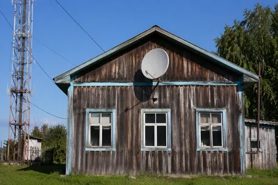 Rural Satellite Dish Under Clear Blue Sky