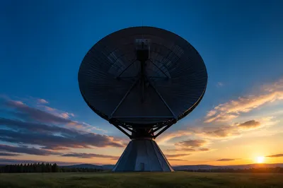 Satellite Communication Dish Under Blue Sunset Sky
