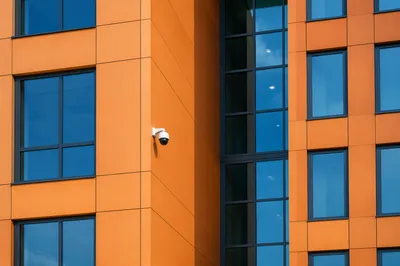 Dome Security Camera on Modern Office Facade