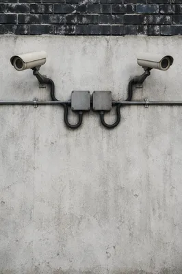 Wall Mounted Security Cameras on Concrete Exterior