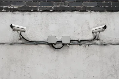 Wall Mounted Security Cameras on Concrete Building