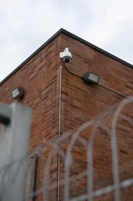 Dome Security Camera on Brick Building