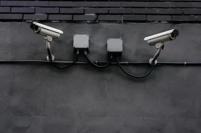 Wall Mounted Security Cameras on Concrete Building