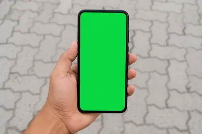 Hand Holding Smartphone With Green Screen