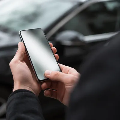Close-Up Hand Holding Smartphone Screen