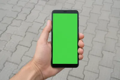 Hand Holding Smartphone with Green Screen