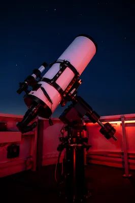 Astronomical Telescope Under Red Night Glow