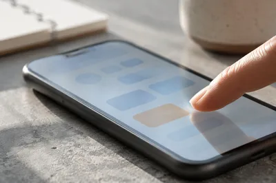 Finger Tapping Smartphone Screen Close Up