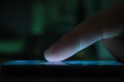 Finger Tapping Smartphone Screen Close Up