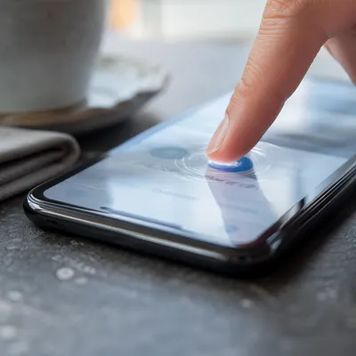 Finger Tapping Smartphone Screen Close Up