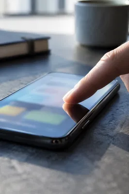 Close-Up Finger Tapping Smartphone Screen