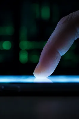 Macro Finger Tapping Smartphone Screen