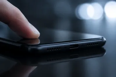 Fingertip Tapping Sleek Smartphone Screen