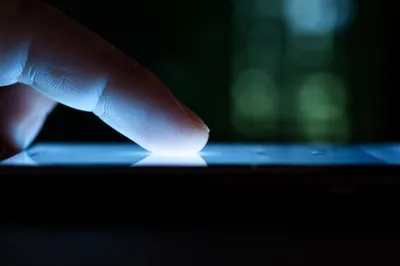 Finger Tapping Smartphone Screen Macro Close-Up