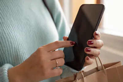 Close-Up Finger Tapping Smartphone Screen