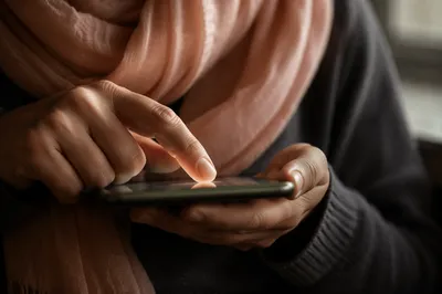 Close-Up Finger Tapping Smartphone Screen