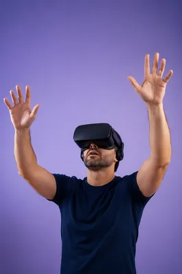Person in VR Headset Raising Hands