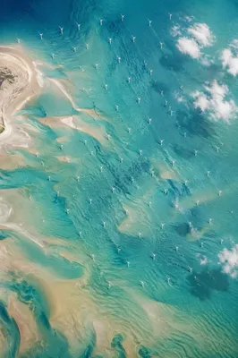Offshore Wind Turbines Over Turquoise Coast