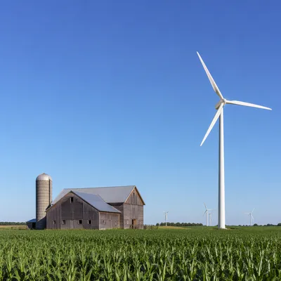 Wind Turbine Over Green Rural Farmland