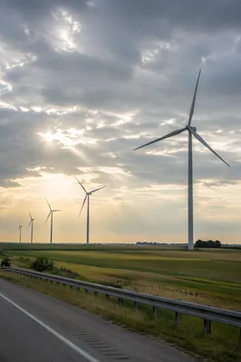 Wind Turbines Over Green Farmland