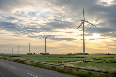 Wind Turbines Across Hopeful Green Farmland